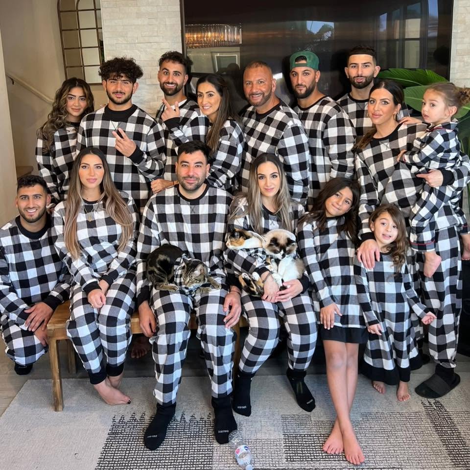 The Furrha Family together in matching plaid pajamas